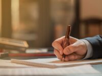 director-signing-documents-with-fashion-pen-high-quality-photo_optimized-scaled.jpg